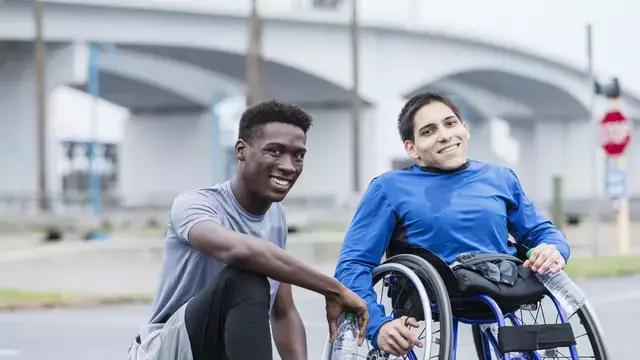 Person in a wheelchair with friend