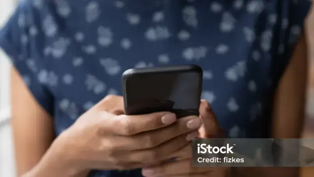 A person making a call on a cell phone