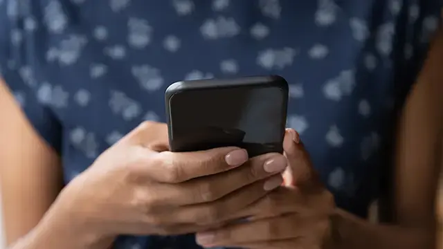 Lady typing on her cell