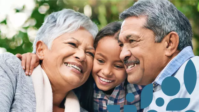 Grandparents and child hugging