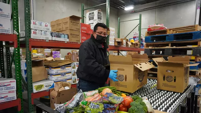 CFCG partner, Arcadios Produce, prepares food for delivery