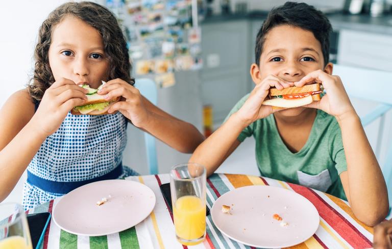 Kids eating sandwiches