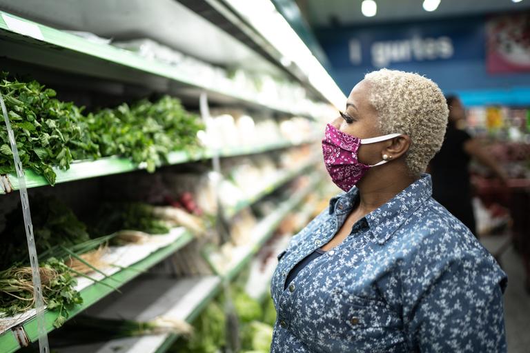 Woman wearing facemask at market
