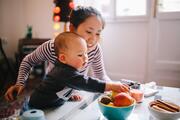 Mother and child eating